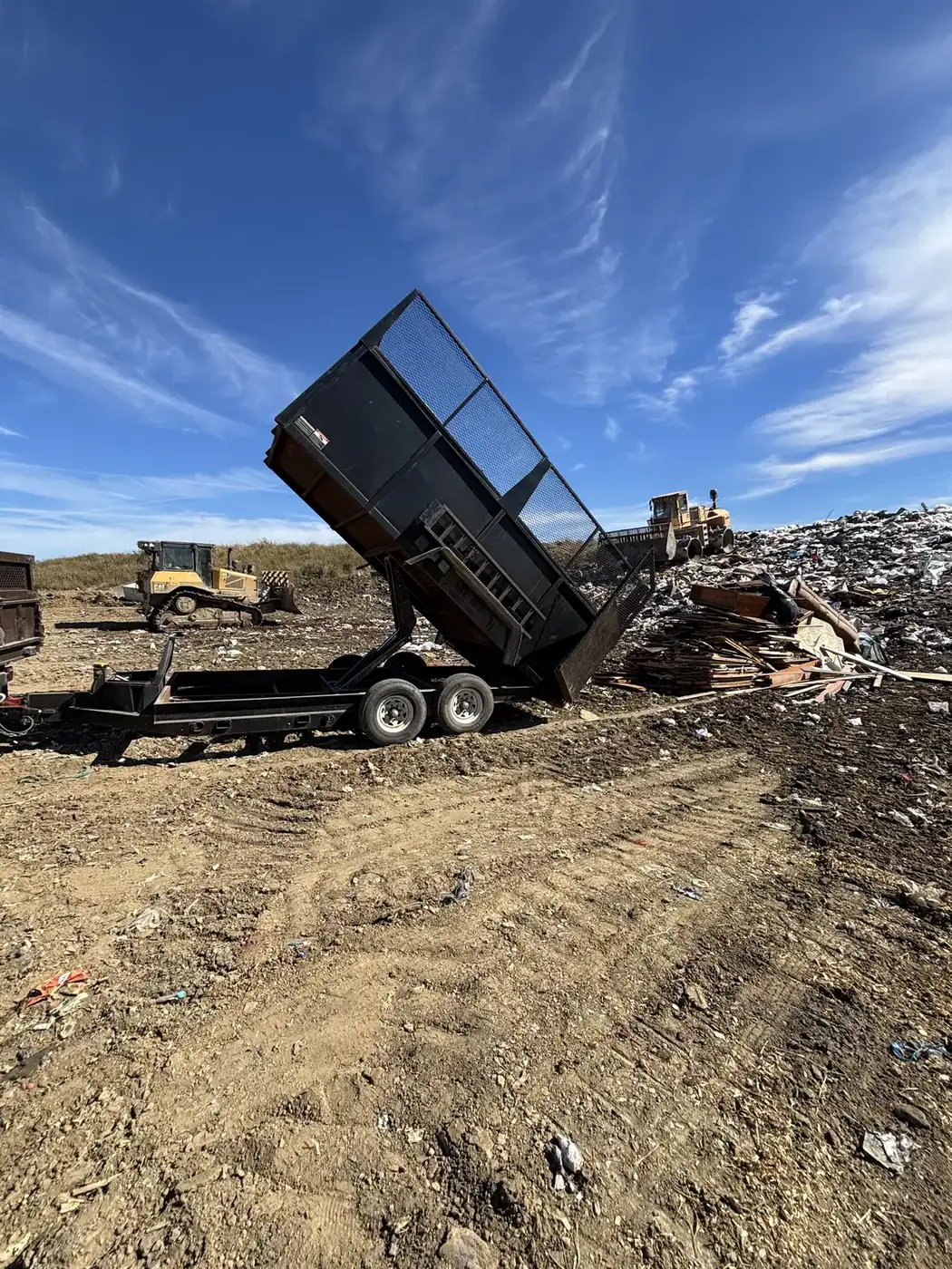 Phelps dump trailer unloading construction debris