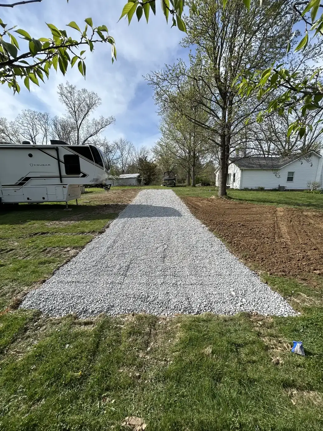 New gravel driveway and RV parking pad built by Phelps