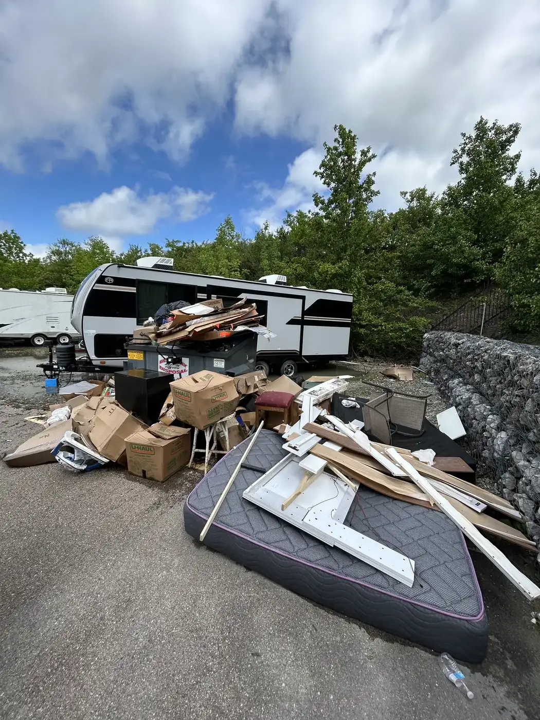 Household junk, furniture and renovation debris staged for Phelps junk removal