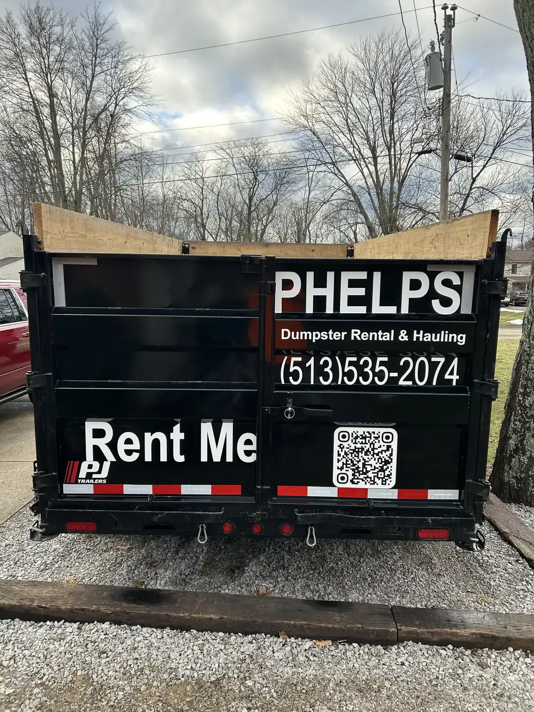 Phelps dump trailer with company phone number ready for rental in Greater Cincinnati