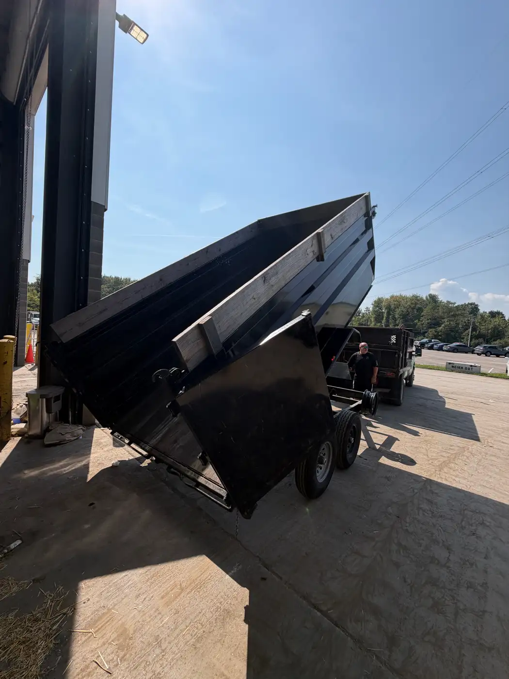 Phelps dump trailer with the bed raised after unloading a hauling load