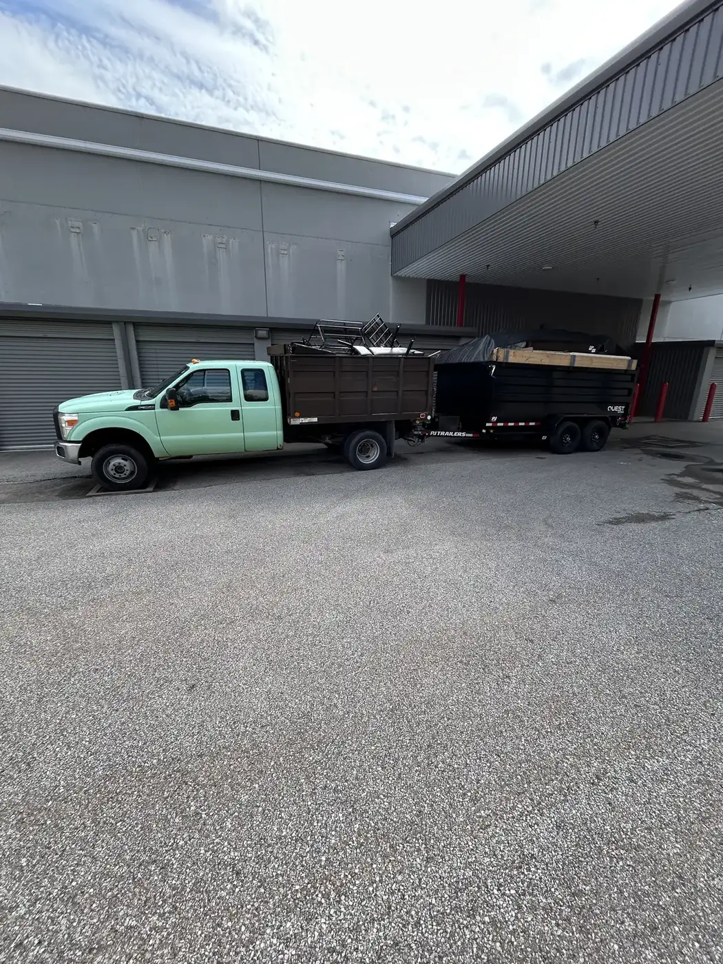 Phelps truck and dumpster at a commercial building cleanout